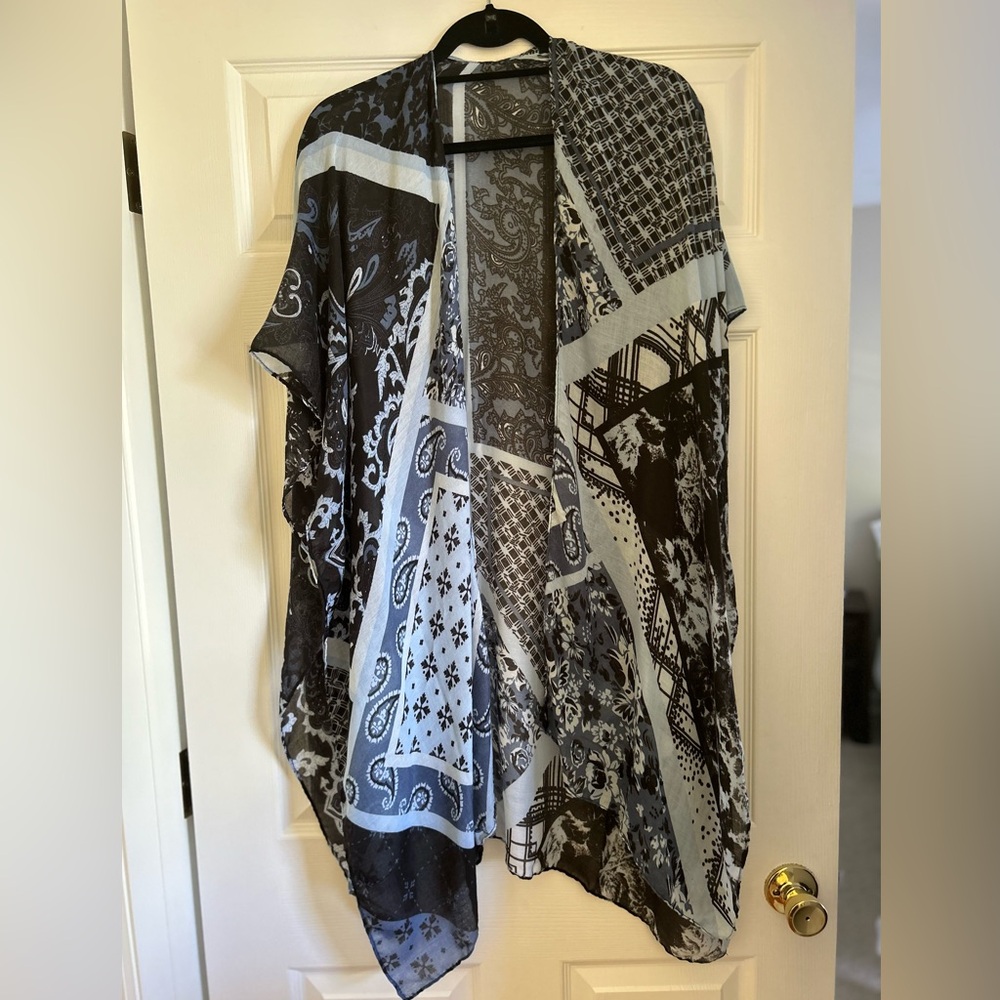 Blue/White Kimono; good condition; one small tear at top of the neck in back.